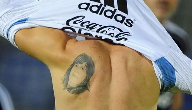 Messi mother's face tattoo on back